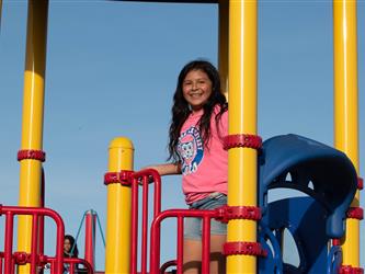 Photo of student climbing by slide