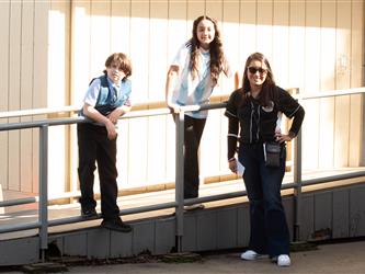 Photos of two students and Principal