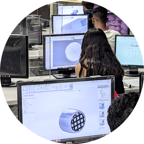 Students working on computer-aided design program
